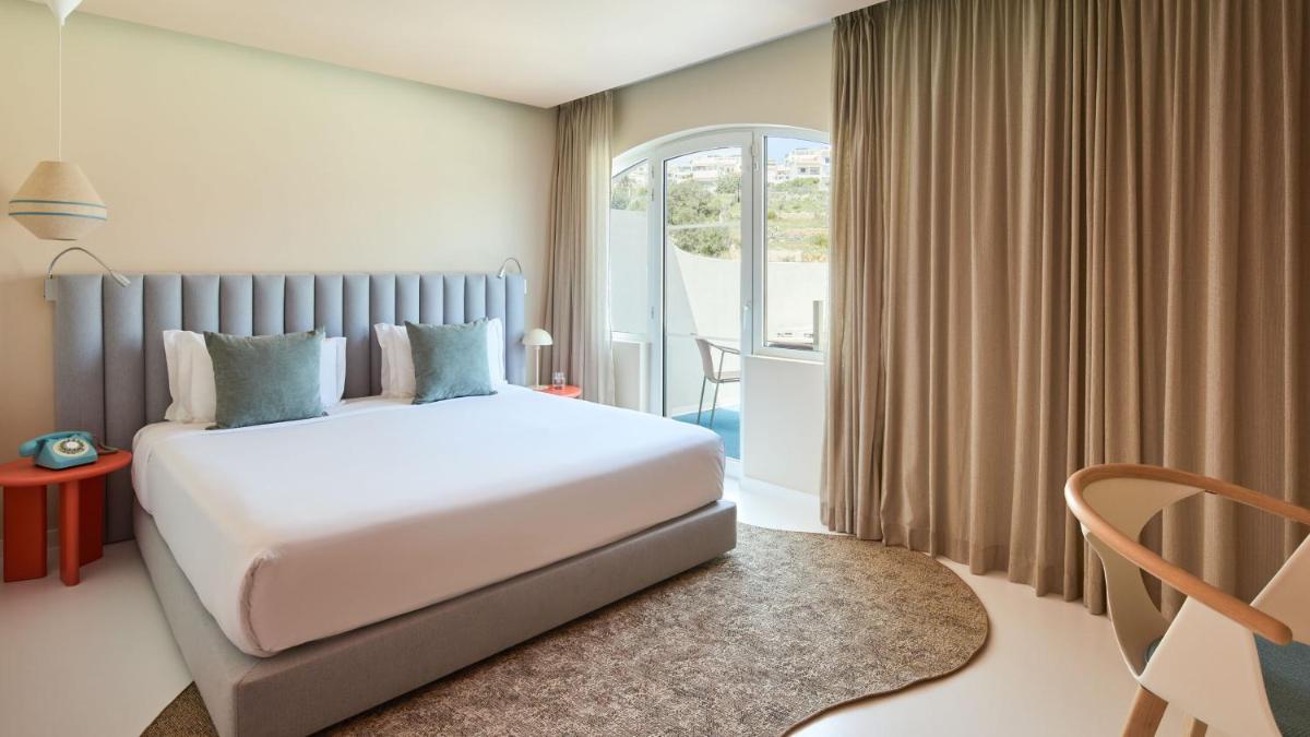 Uma cama ou camas num quarto em Hotel Indigo Albufeira by IHG