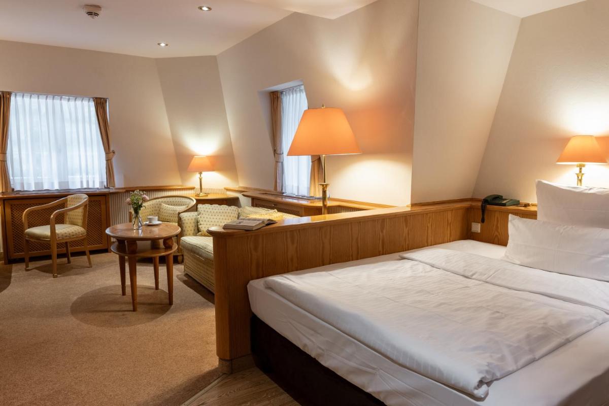 Ein Bett oder Betten in einem Zimmer der Unterkunft Waldhaus Reinbek