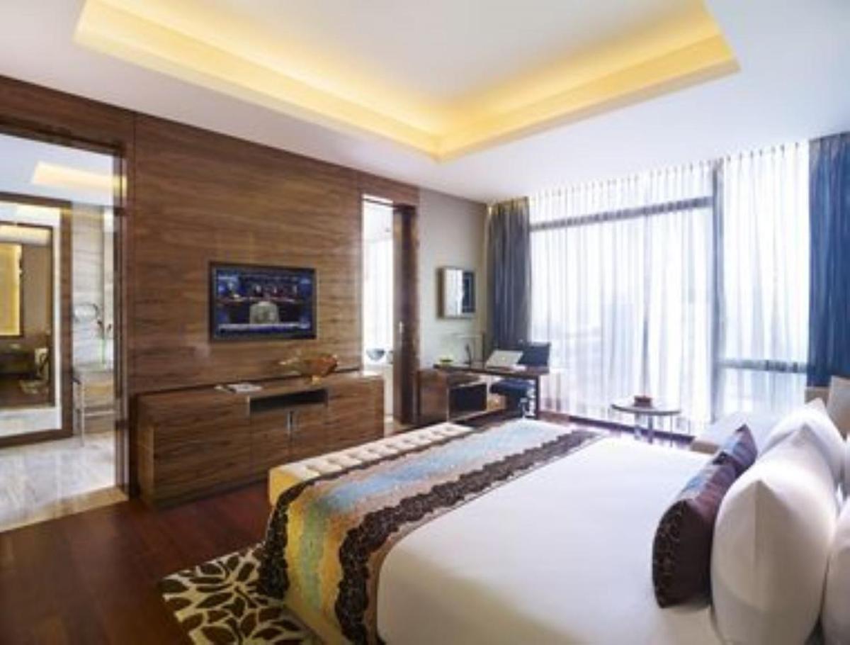a bedroom with a large bed in a room at Taj City Centre Gurugram in Gurgaon