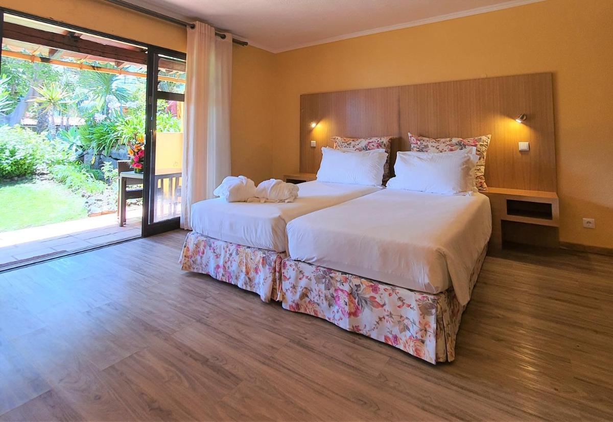 Uma cama ou camas num quarto em Quinta Splendida Wellness & Botanical Garden