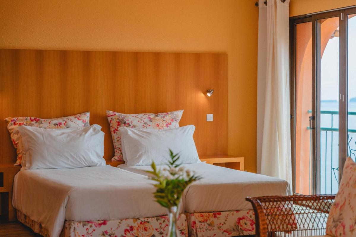 Uma cama ou camas num quarto em Quinta Splendida Wellness & Botanical Garden