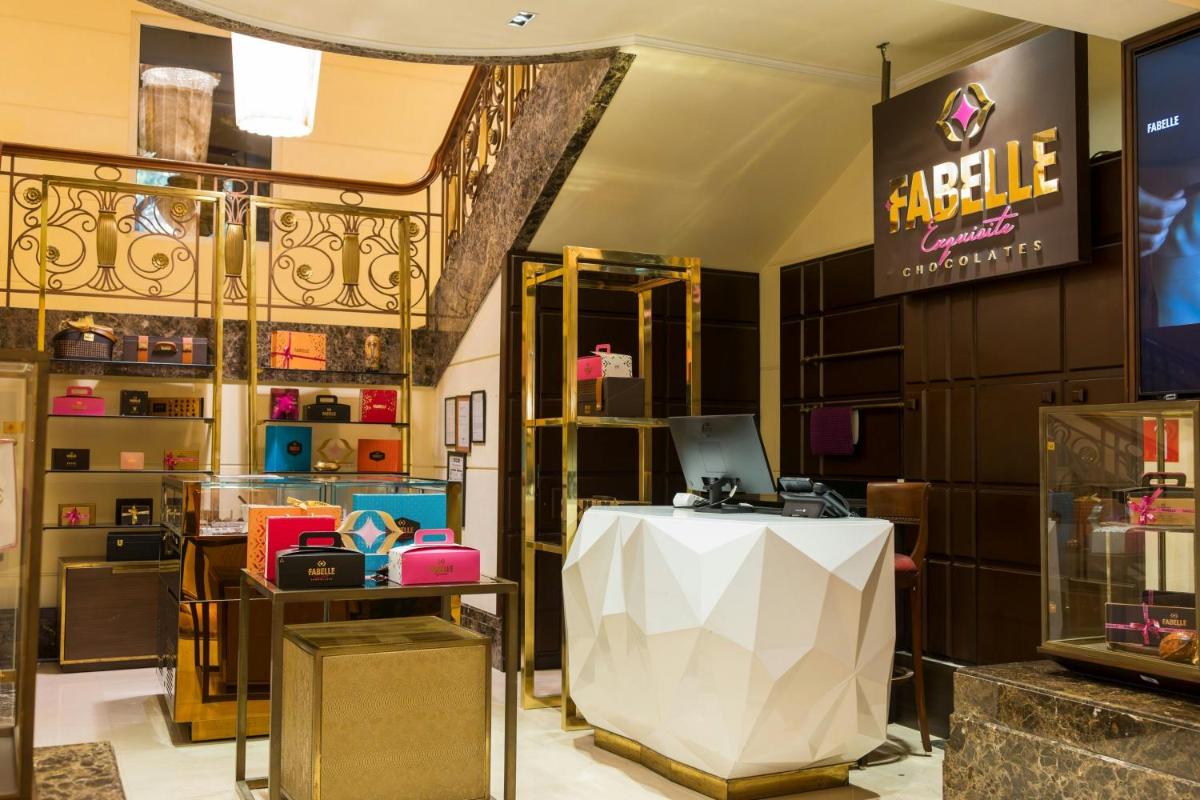 a store with a table with a laptop on it at ITC Grand Central, a Luxury Collection Hotel, Mumbai in Mumbai