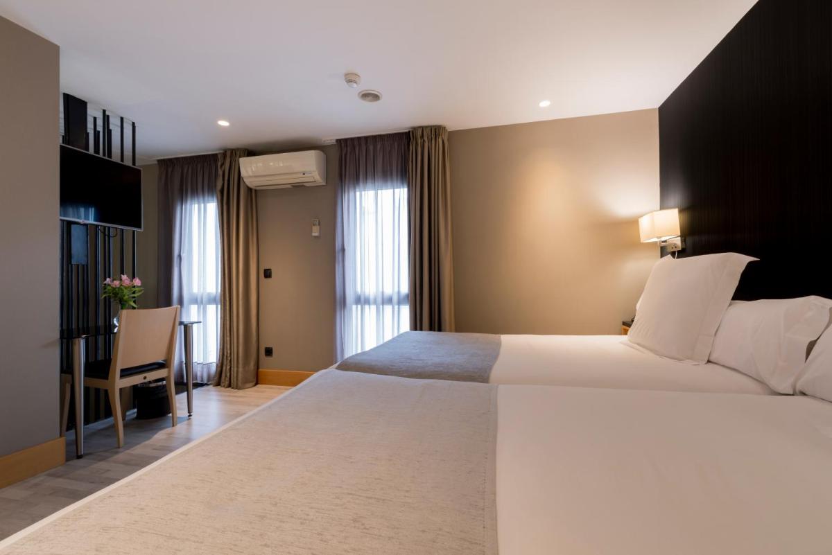 Cama o camas de una habitación en Hotel Plaza