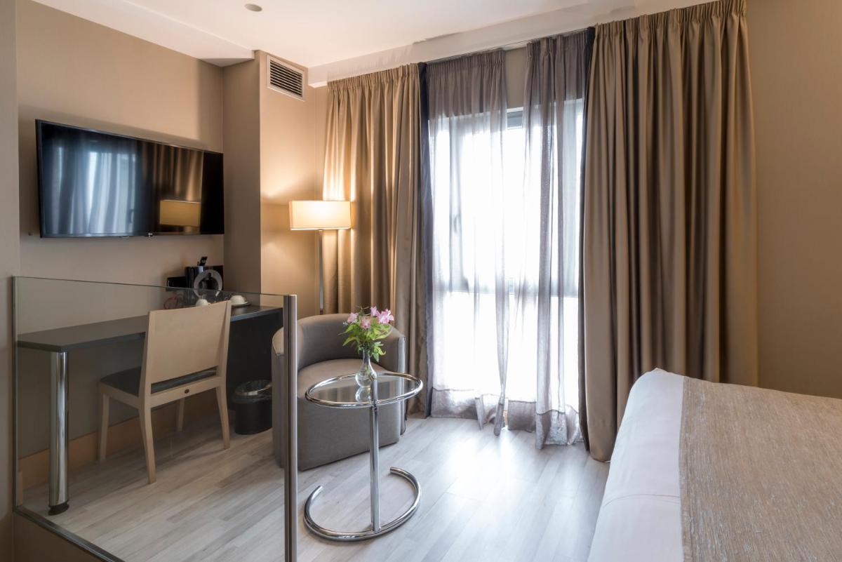 Cama o camas de una habitación en Hotel Plaza