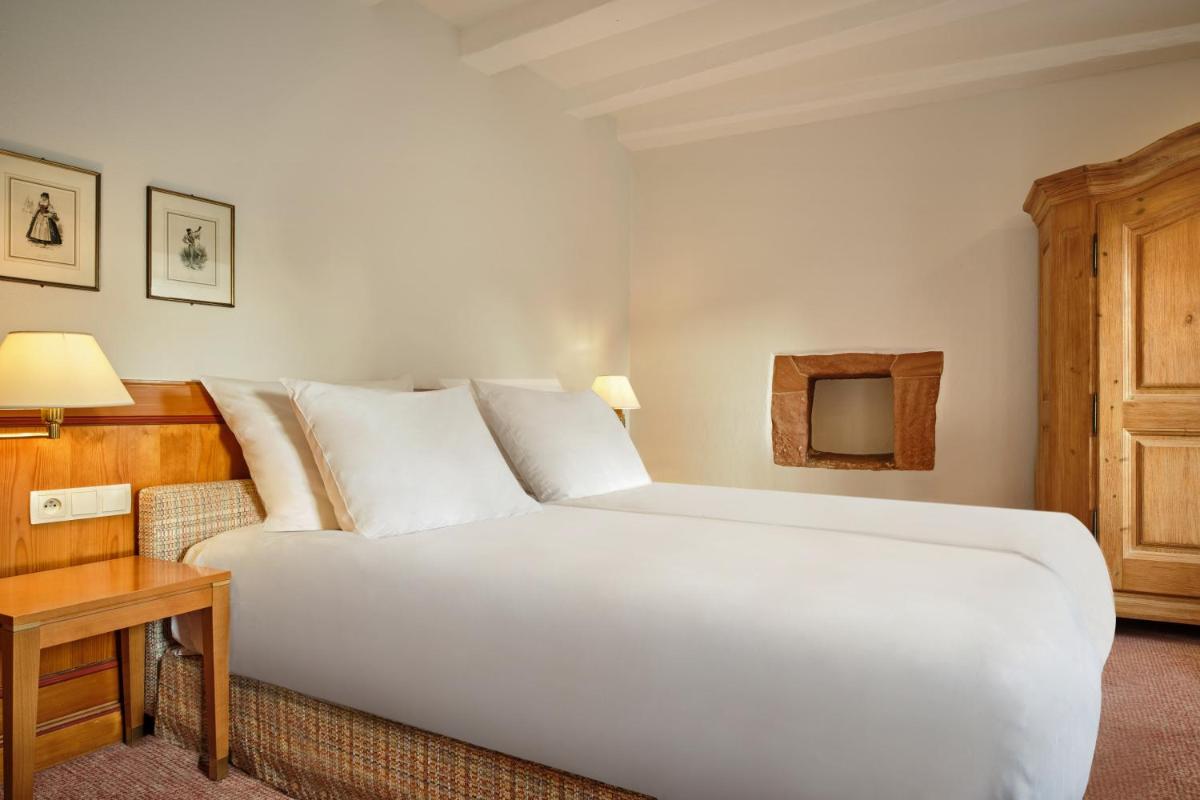 Un ou plusieurs lits dans un hébergement de l'établissement Hotel & Spa A la cour d'Alsace by HappyCulture