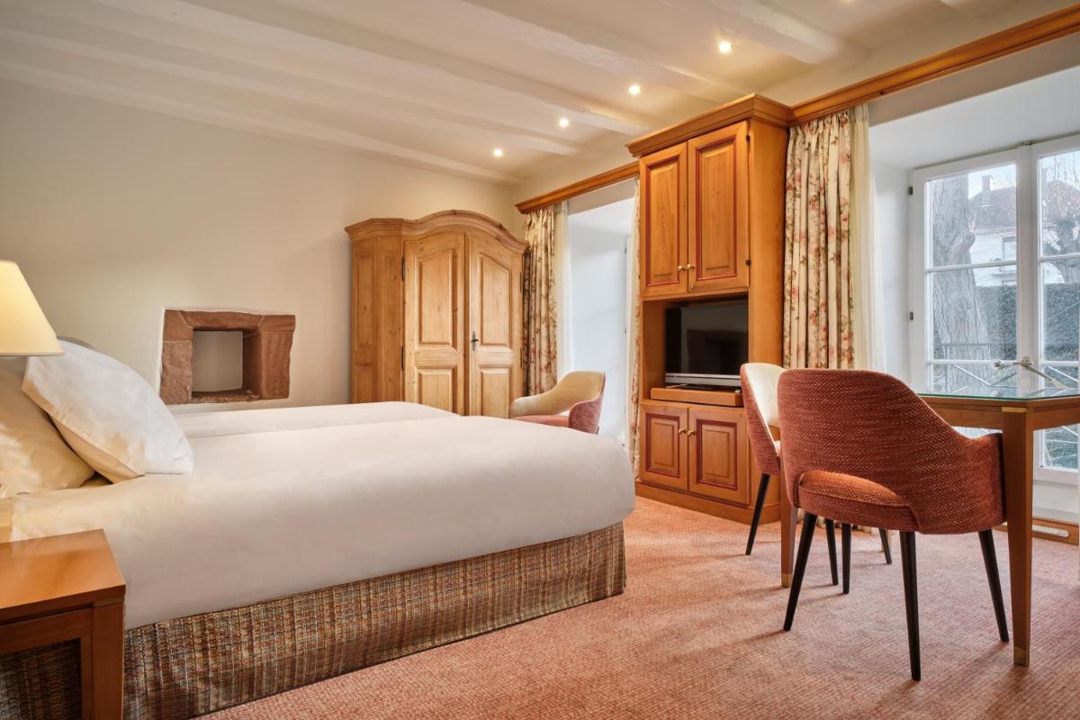 Un ou plusieurs lits dans un hébergement de l'établissement Hotel & Spa A la cour d'Alsace by HappyCulture