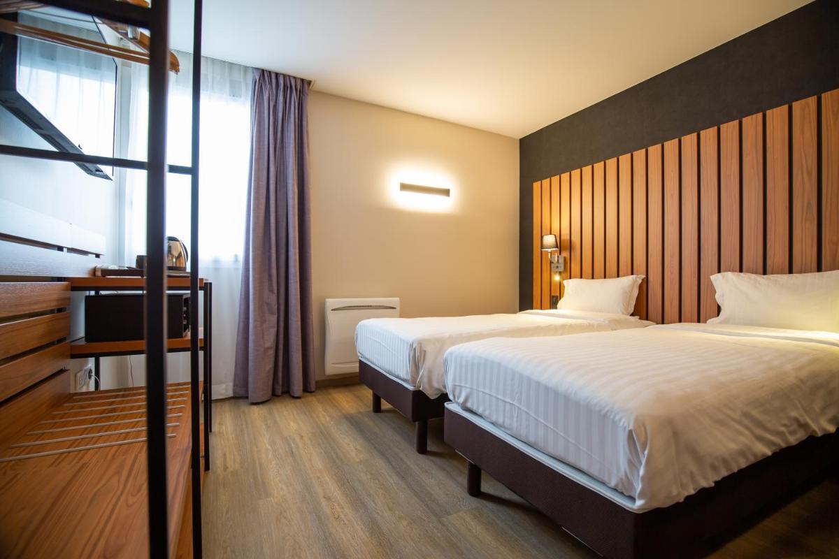 Un ou plusieurs lits dans un hébergement de l'établissement Best Western Côte des Sables Plouescat