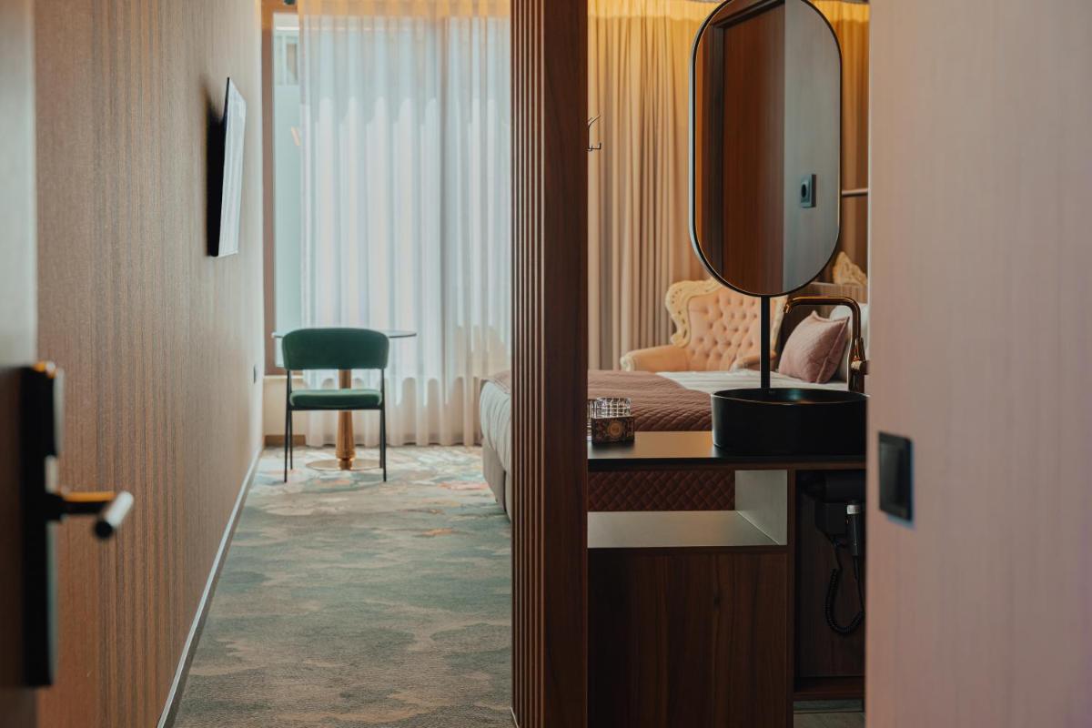 Uma cama ou camas num quarto em Hotel Leiriartem by Grupo Quinta dos Lagos