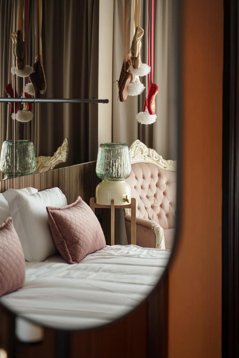 Uma cama ou camas num quarto em Hotel Leiriartem by Grupo Quinta dos Lagos