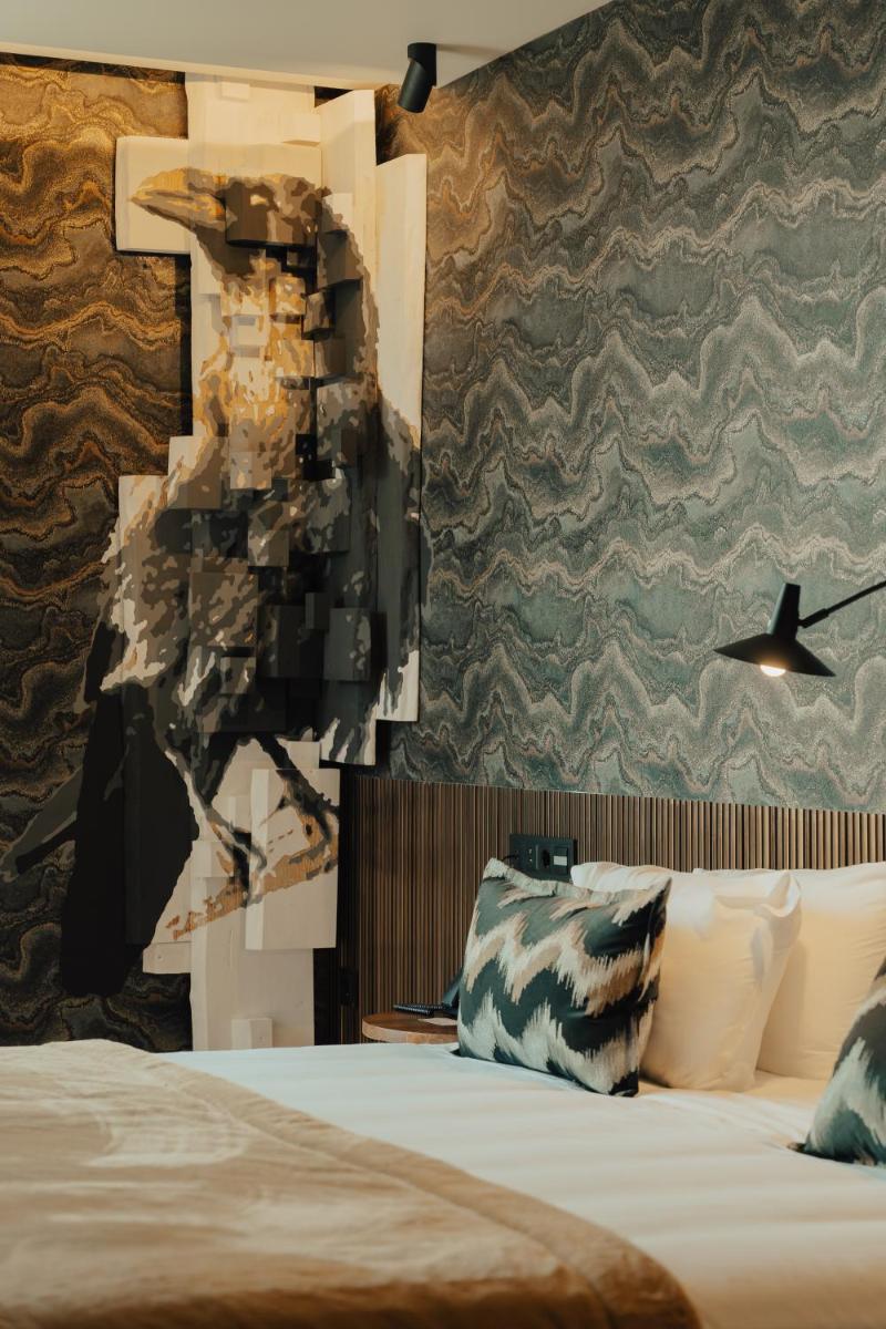 Uma cama ou camas num quarto em Hotel Leiriartem by Grupo Quinta dos Lagos
