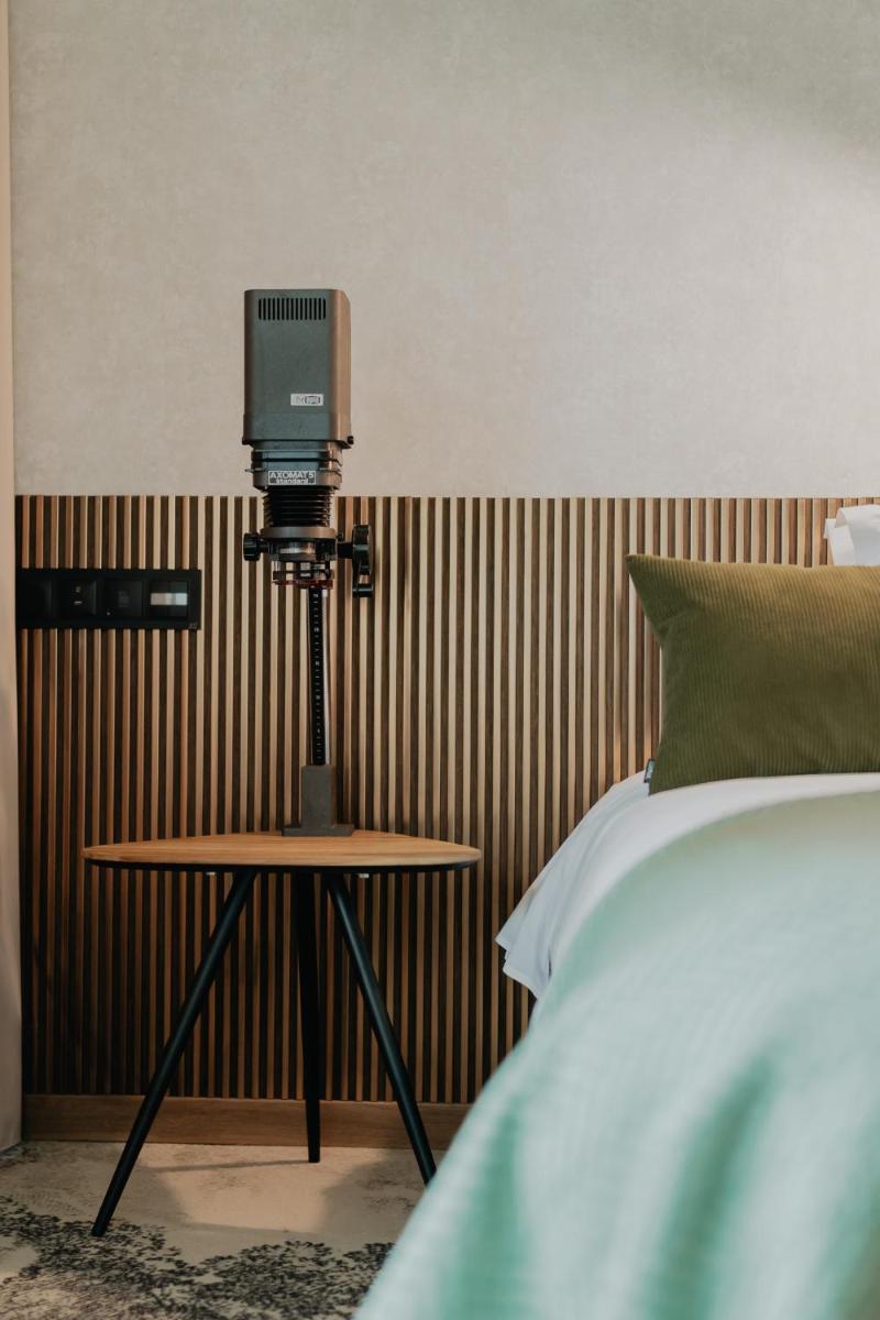 Uma cama ou camas num quarto em Hotel Leiriartem by Grupo Quinta dos Lagos