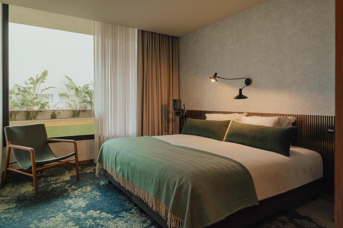 Uma cama ou camas num quarto em Hotel Leiriartem by Grupo Quinta dos Lagos