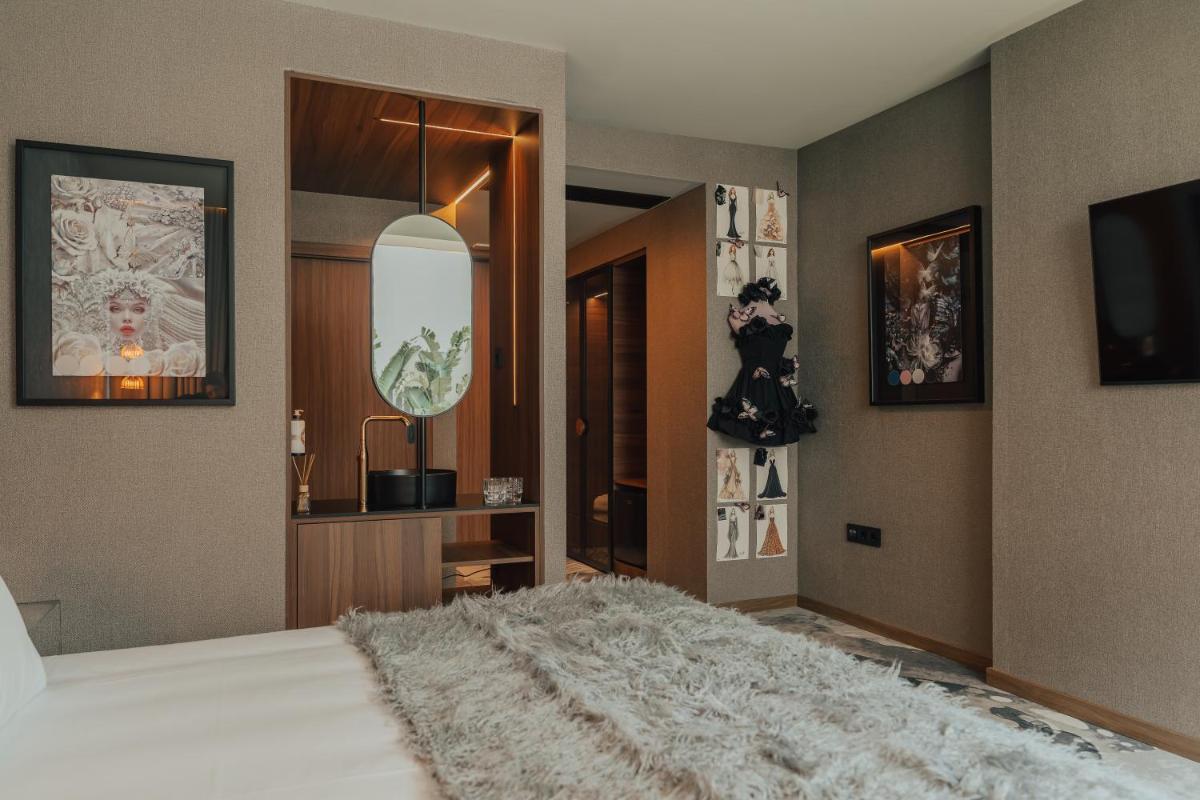 Uma cama ou camas num quarto em Hotel Leiriartem by Grupo Quinta dos Lagos