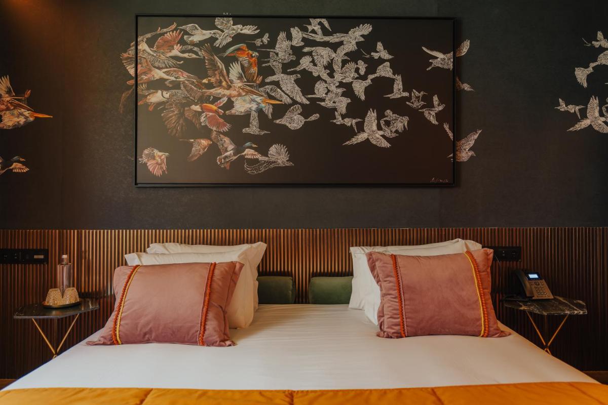 Uma cama ou camas num quarto em Hotel Leiriartem by Grupo Quinta dos Lagos