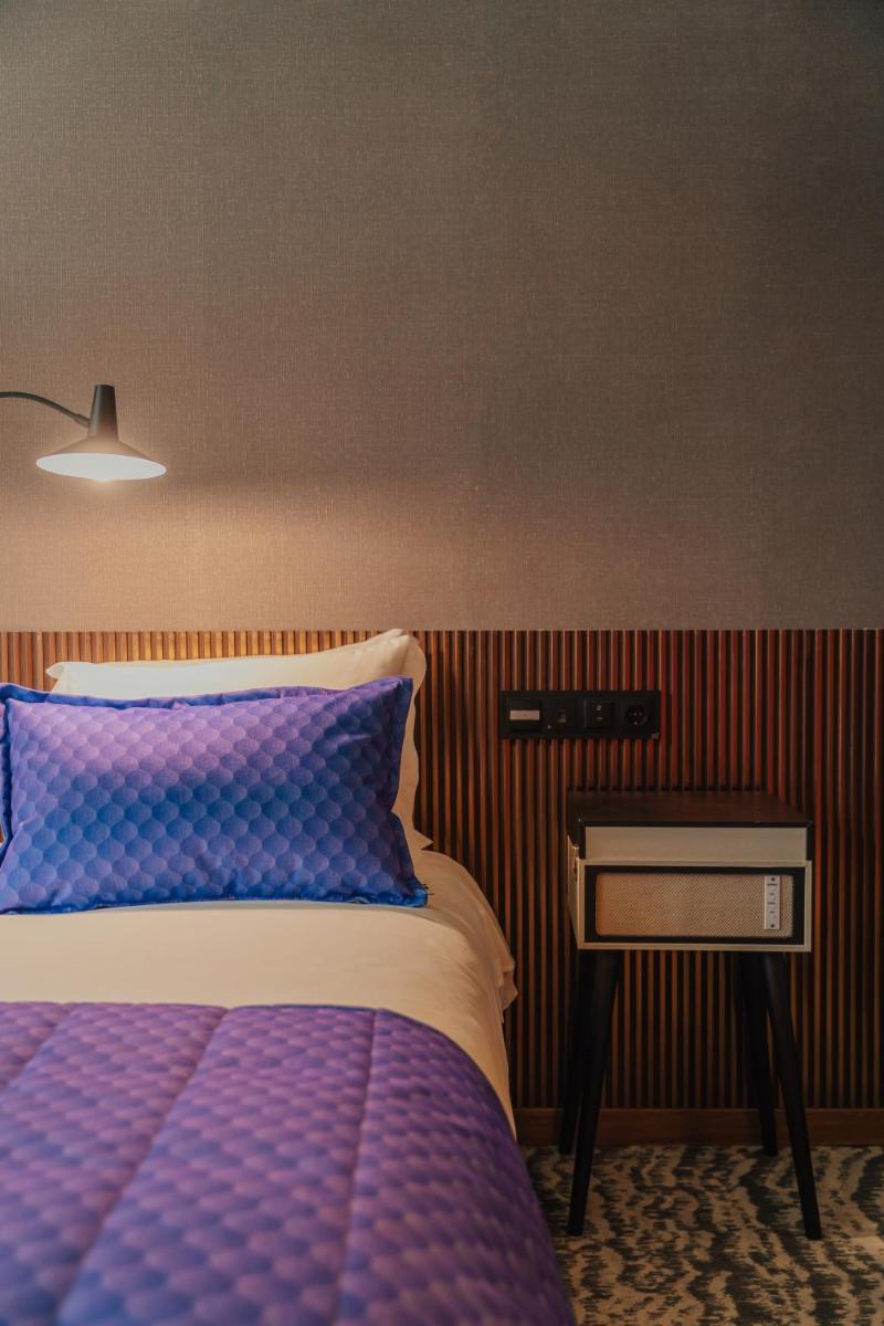 Uma cama ou camas num quarto em Hotel Leiriartem by Grupo Quinta dos Lagos