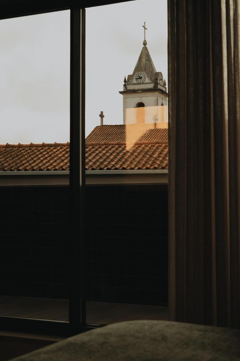 Uma cama ou camas num quarto em Hotel Leiriartem by Grupo Quinta dos Lagos
