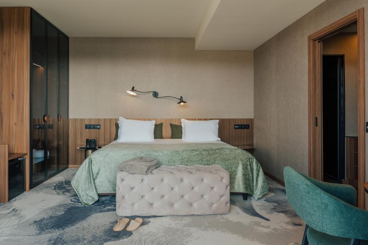 Uma cama ou camas num quarto em Hotel Leiriartem by Grupo Quinta dos Lagos