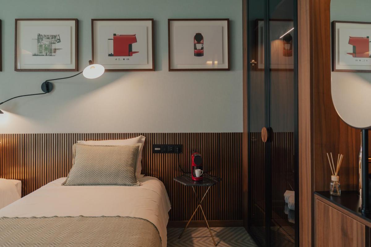 Uma cama ou camas num quarto em Hotel Leiriartem by Grupo Quinta dos Lagos
