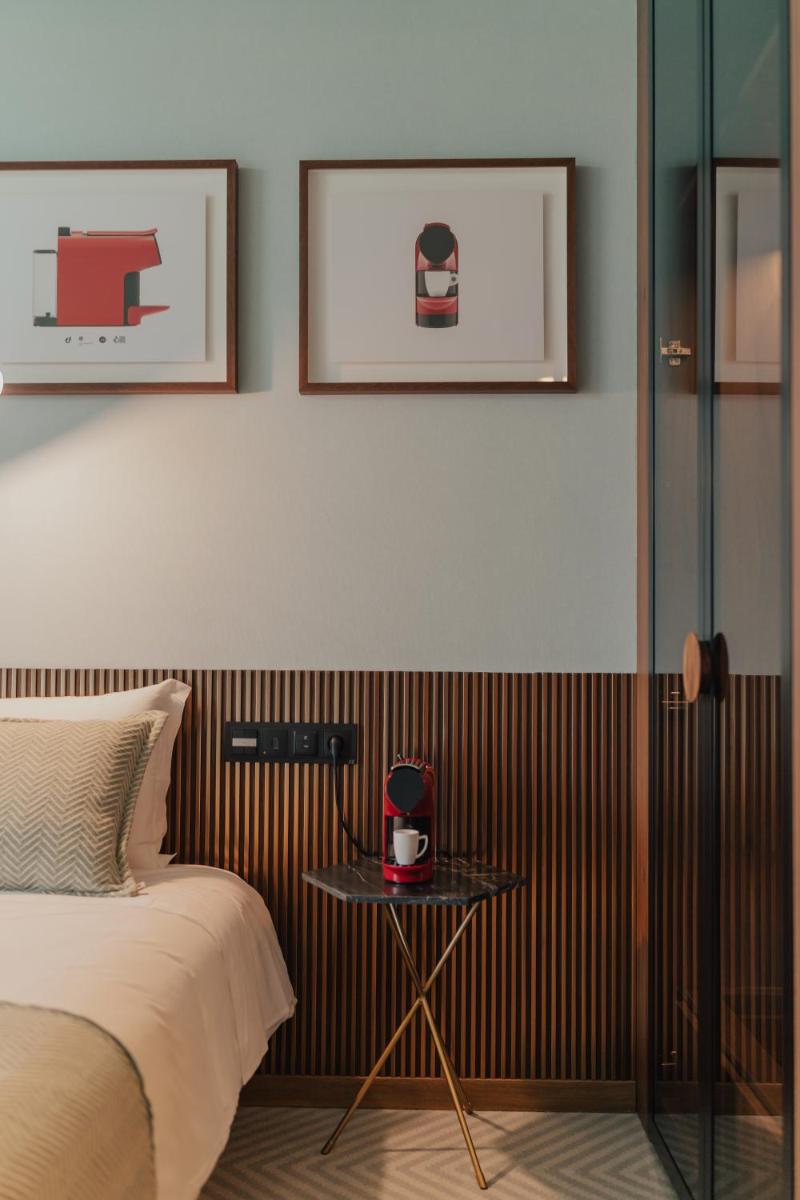 Uma cama ou camas num quarto em Hotel Leiriartem by Grupo Quinta dos Lagos