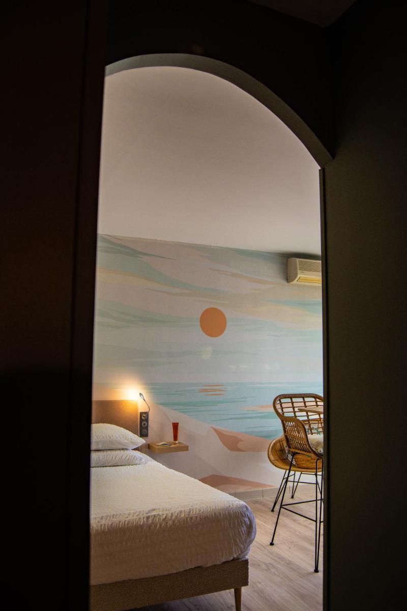 Un ou plusieurs lits dans un hébergement de l'établissement Résidence Hôtelière Natureva & Spa