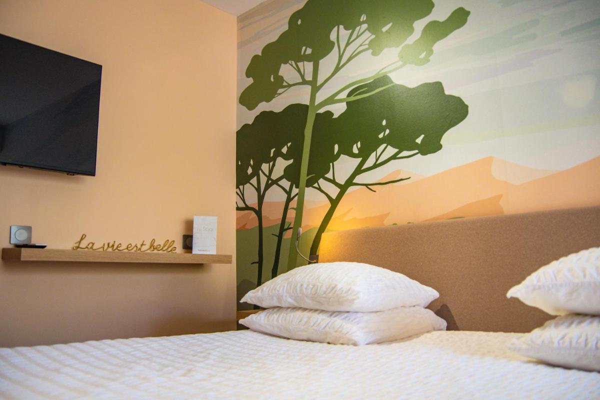 Un ou plusieurs lits dans un hébergement de l'établissement Résidence Hôtelière Natureva & Spa