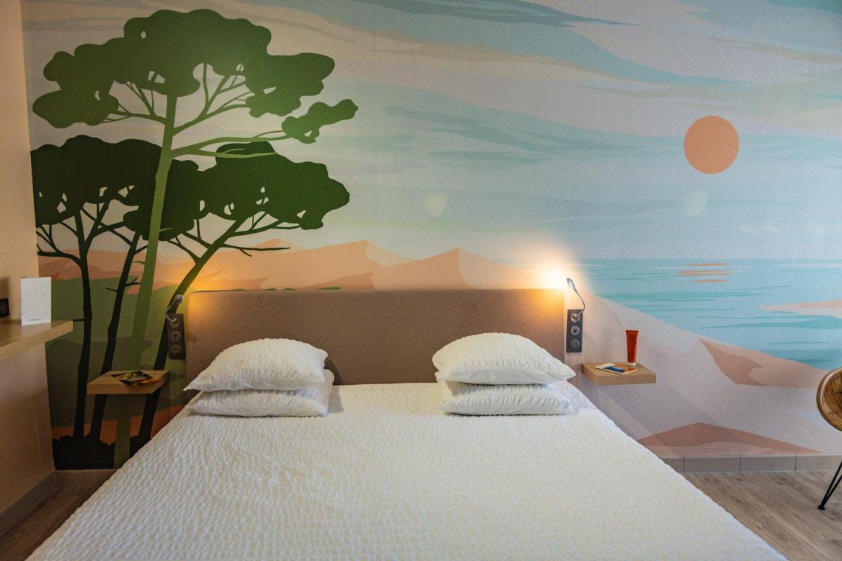 Un ou plusieurs lits dans un hébergement de l'établissement Résidence Hôtelière Natureva & Spa