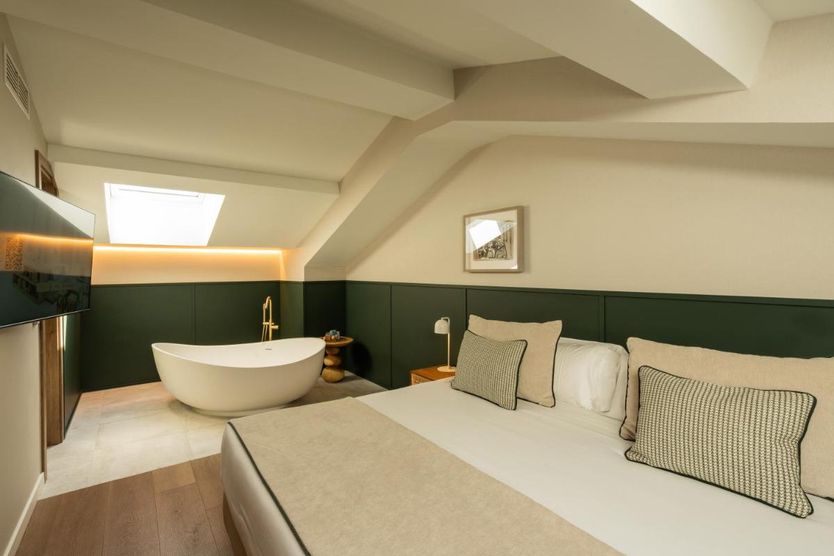 Cama o camas de una habitación en Hotel Well and Come Málaga