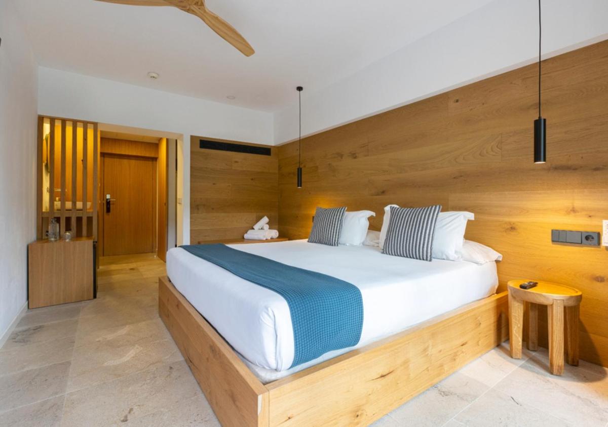 Cama o camas de una habitación en Las Gaviotas Suites Hotel & Spa