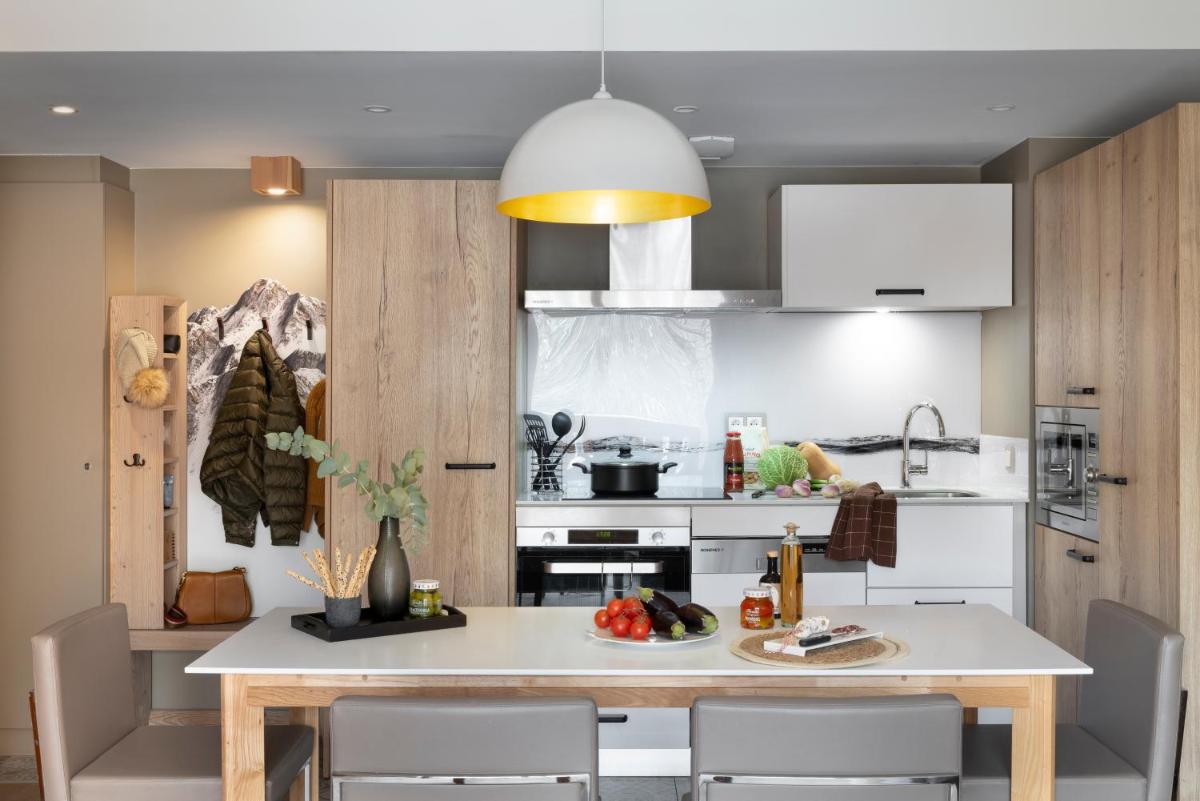 Cuisine ou kitchenette dans l'établissement Résidence Pierre & Vacances Premium L'Hévana