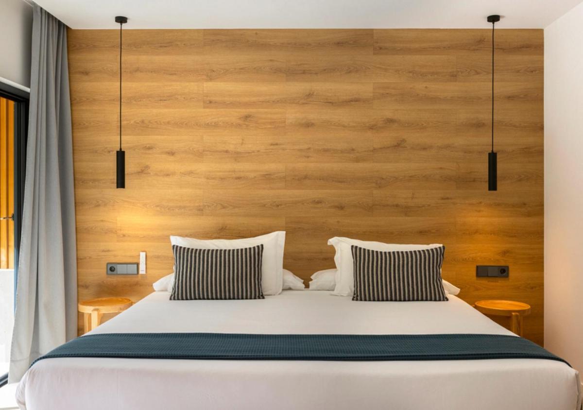 Cama o camas de una habitación en Las Gaviotas Suites Hotel & Spa