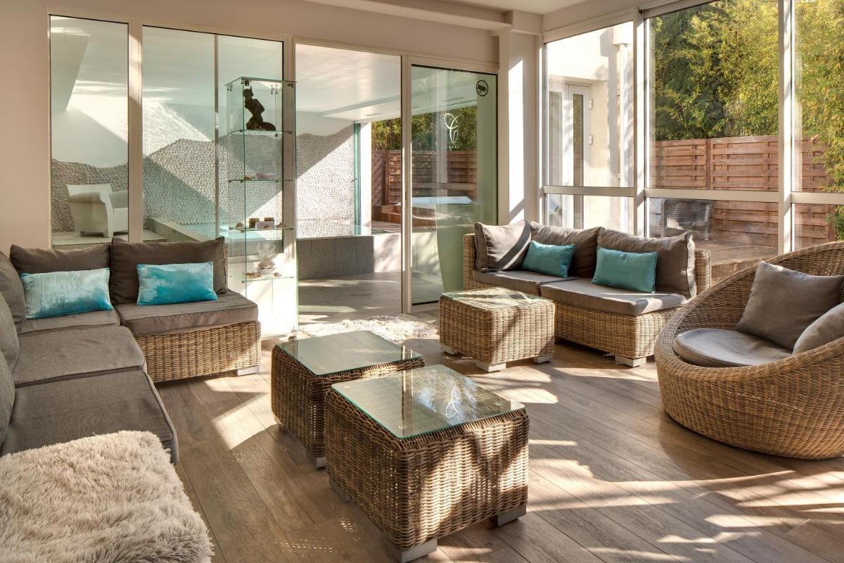 Coin salon dans l'établissement Le Cottage - Hotel & Spa