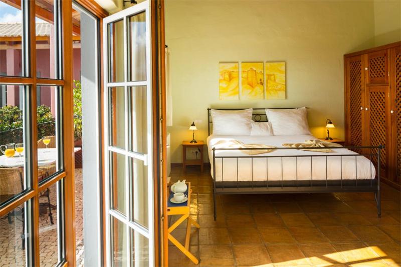 Uma cama ou camas num quarto em Atrio