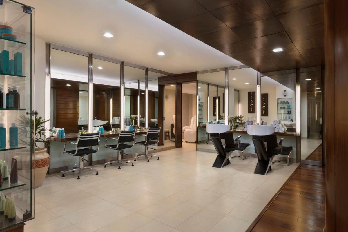 an office with a long table and chairs at Shangri-La Eros New Delhi in New Delhi an office with a long table and chairs at Shangri-La Eros New Delhi in New Delhi