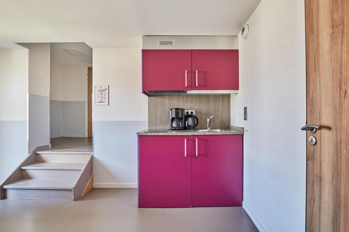 Cuisine ou kitchenette dans l'établissement Appart'hôtel Odalys City - Dijon Centre Les Cordeliers