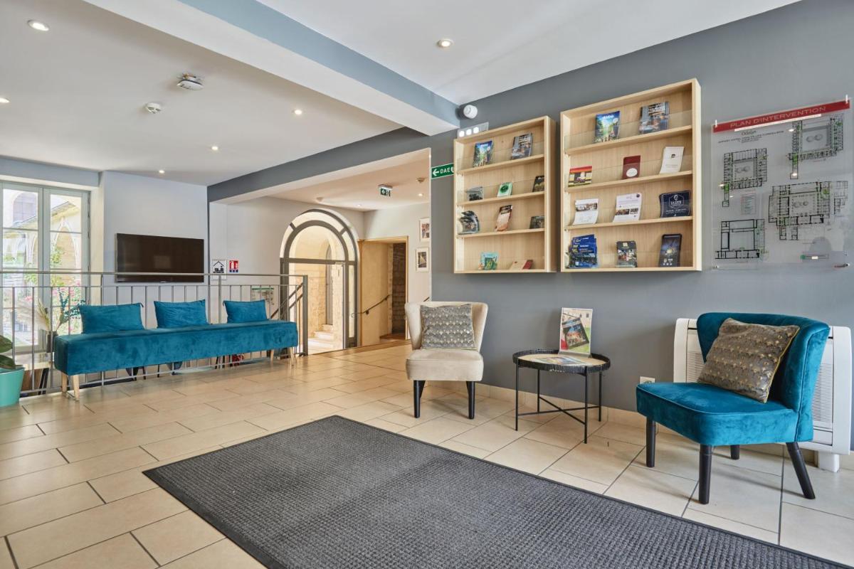 Coin salon dans l'établissement Appart'hôtel Odalys City - Dijon Centre Les Cordeliers
