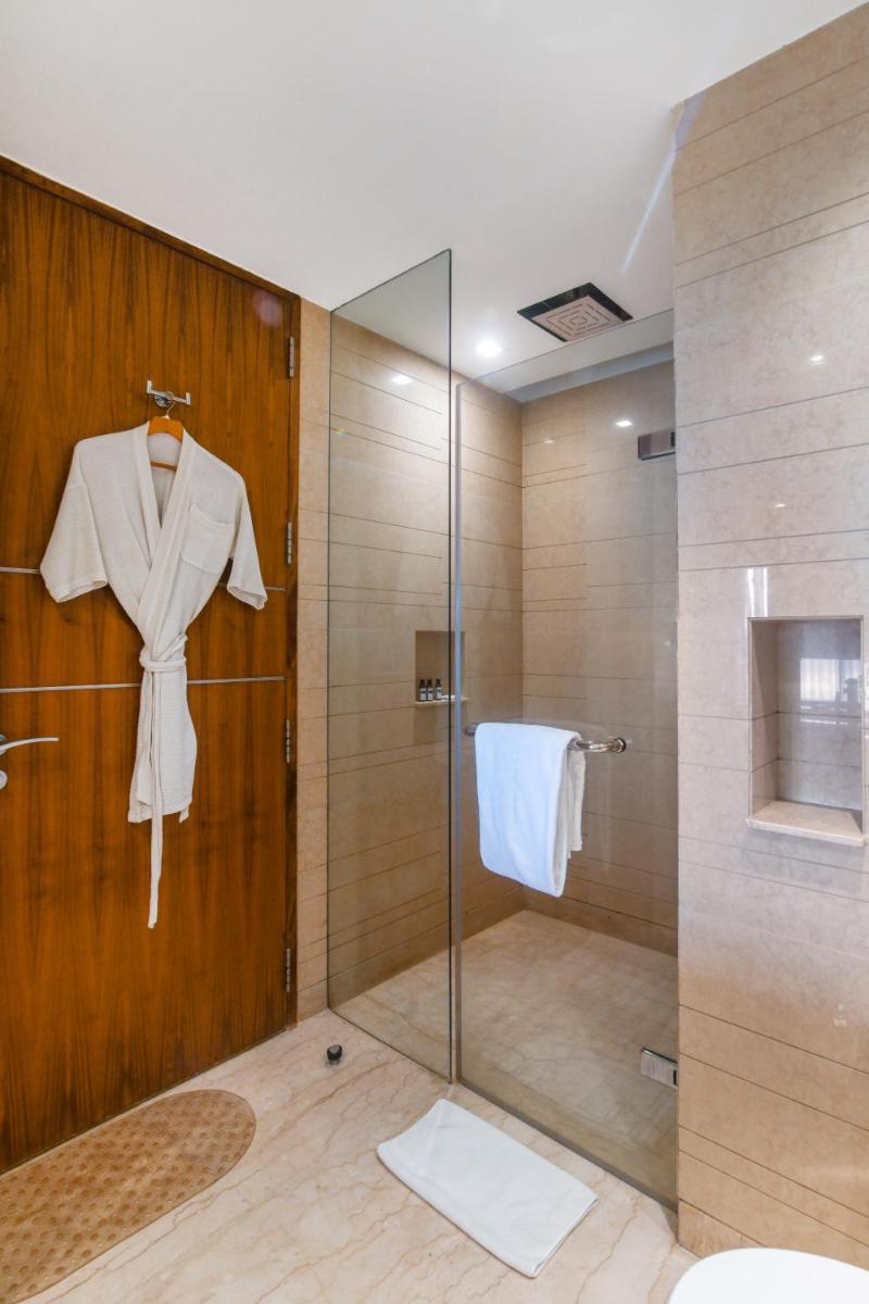 a bathroom with a shower and a glass door at Hyatt Ahmedabad in Ahmedabad