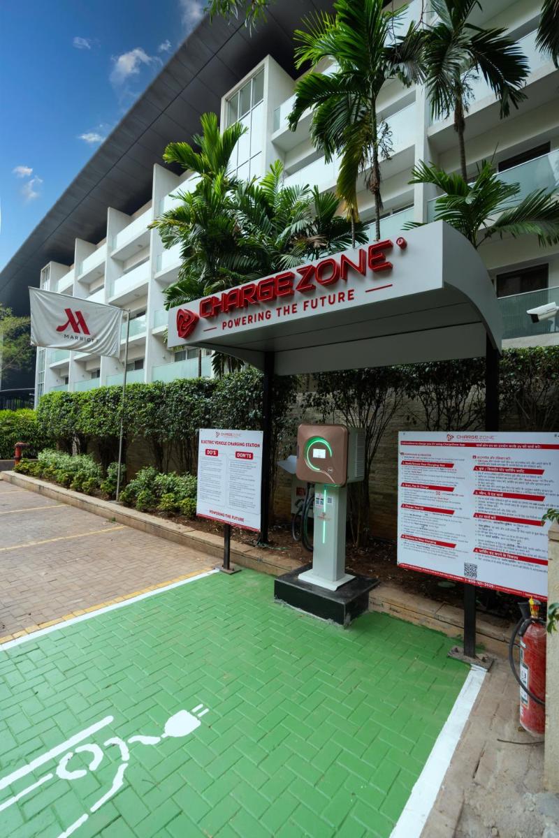 a parking lot in front of a building at Marriott Suites Pune in Pune