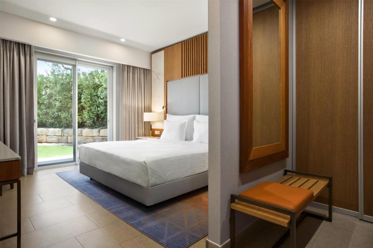 Uma cama ou camas num quarto em Wyndham Grand Algarve