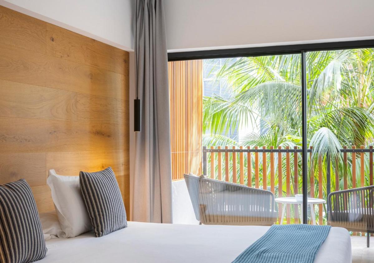 Cama o camas de una habitación en Las Gaviotas Suites Hotel & Spa