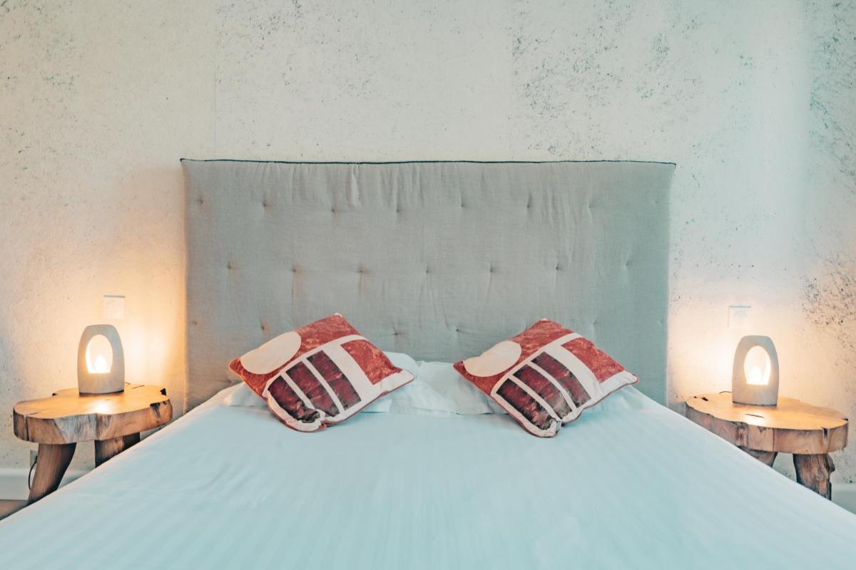 Un ou plusieurs lits dans un hébergement de l'établissement Hôtel Édenia - Spa Estime&Sens
