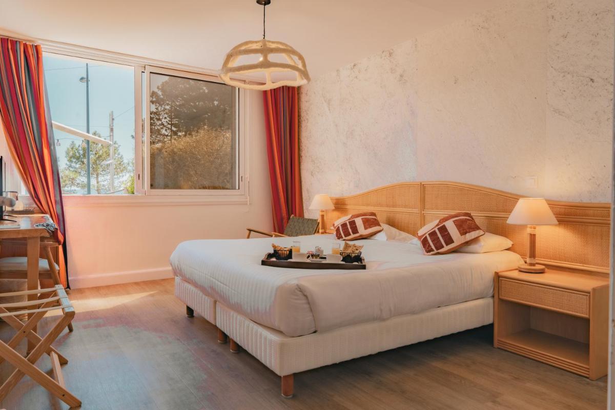 Coin salon dans l'établissement Hôtel Édenia - Spa Estime&Sens