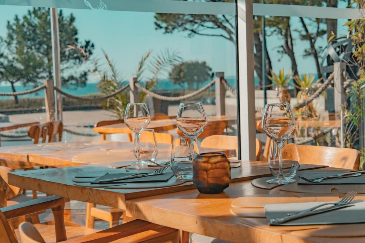 Restaurant ou autre lieu de restauration dans l'établissement Hôtel Édenia - Spa Estime&Sens