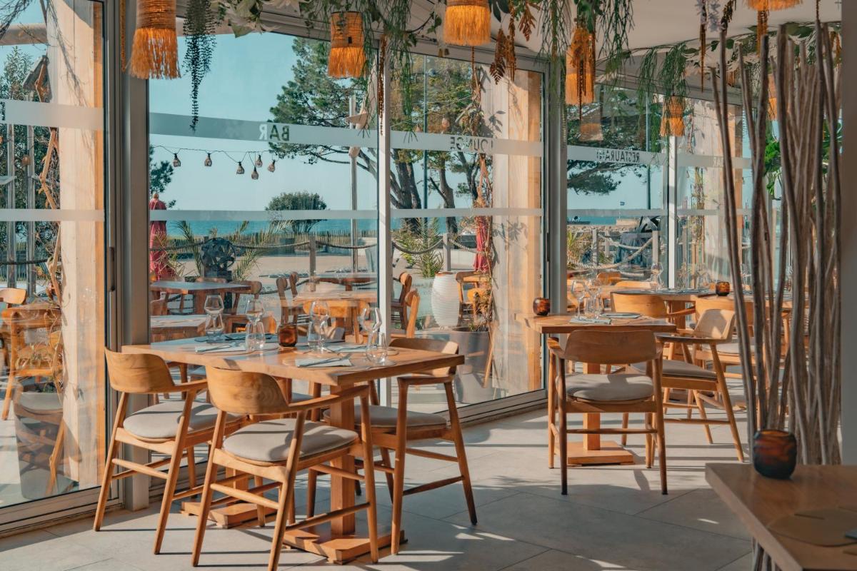 Restaurant ou autre lieu de restauration dans l'établissement Hôtel Édenia - Spa Estime&Sens