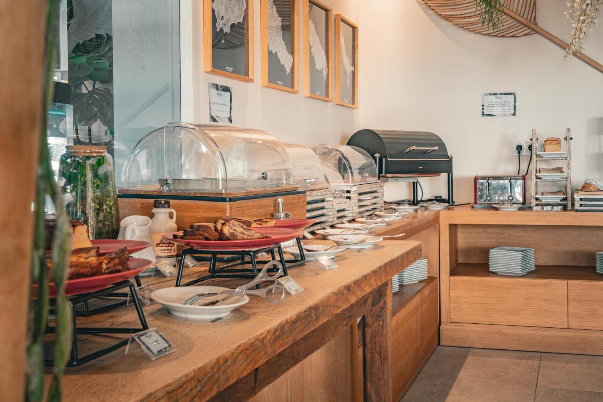 Cuisine ou kitchenette dans l'établissement Hôtel Édenia - Spa Estime&Sens