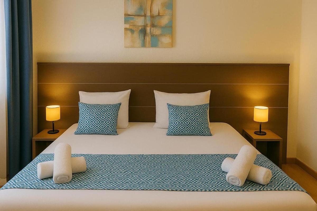 Un ou plusieurs lits dans un hébergement de l'établissement Hotel & Spa Gil de France Cap d'Agde