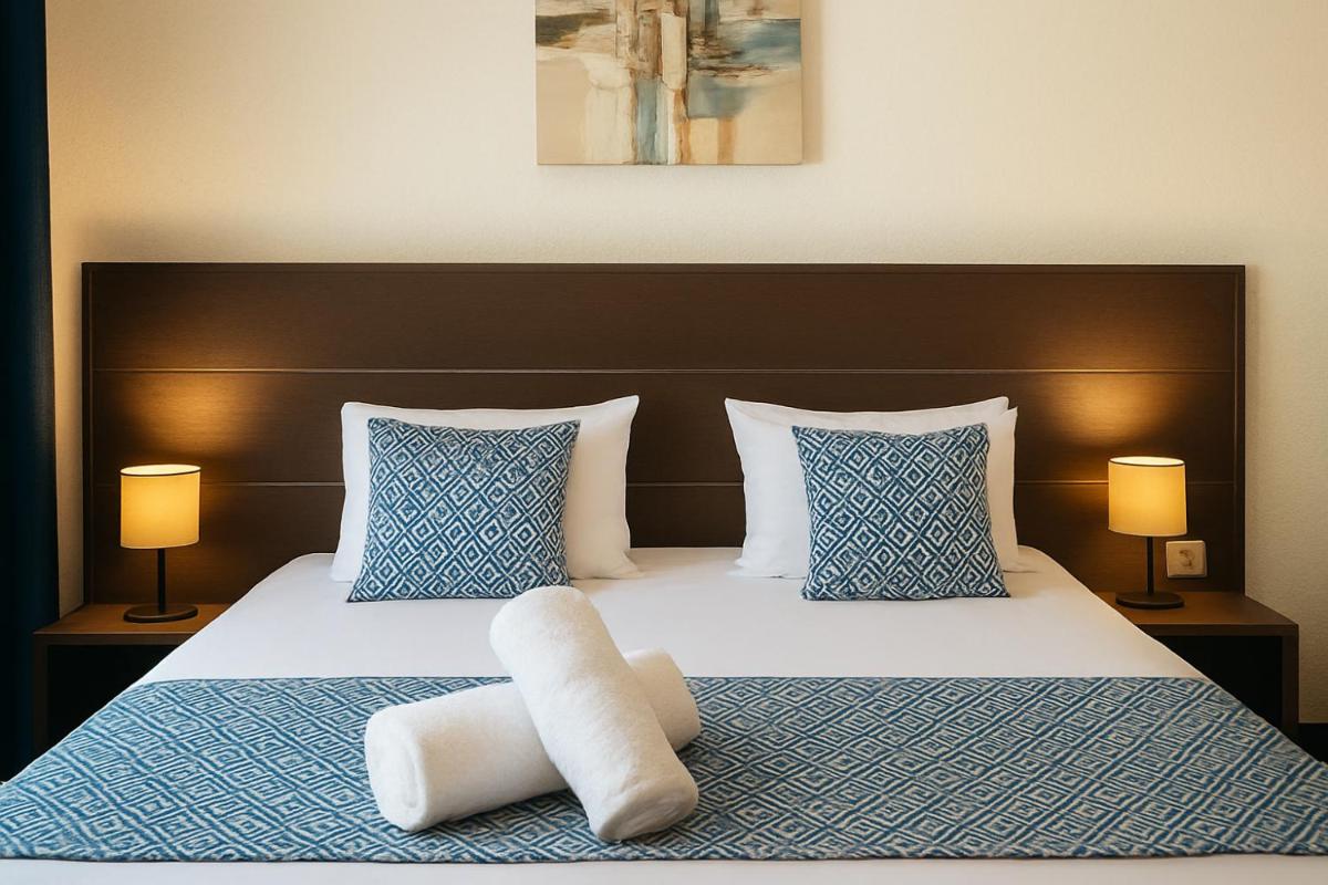 Un ou plusieurs lits dans un hébergement de l'établissement Hotel & Spa Gil de France Cap d'Agde