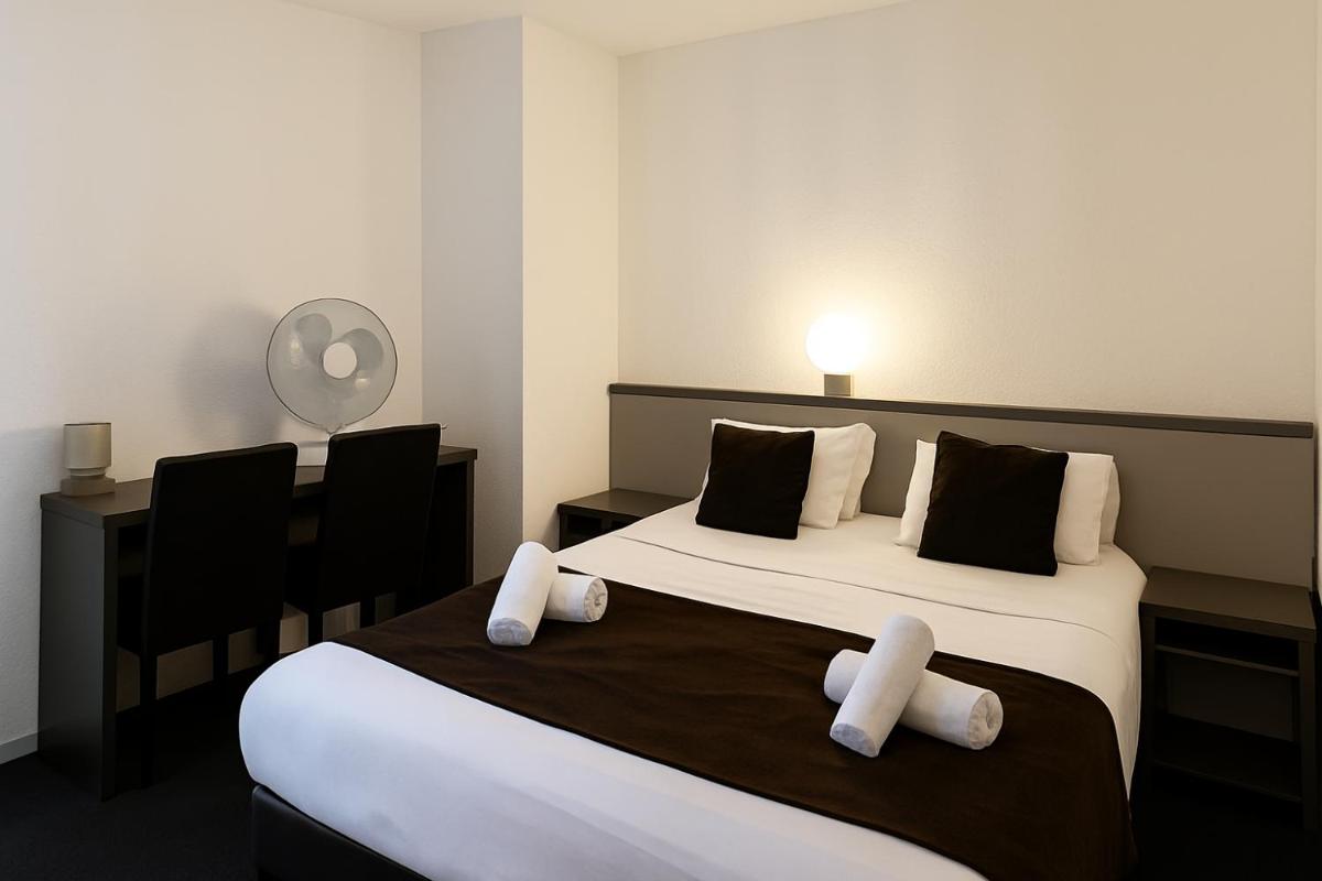 Un ou plusieurs lits dans un hébergement de l'établissement Hotel & Spa Gil de France Cap d'Agde
