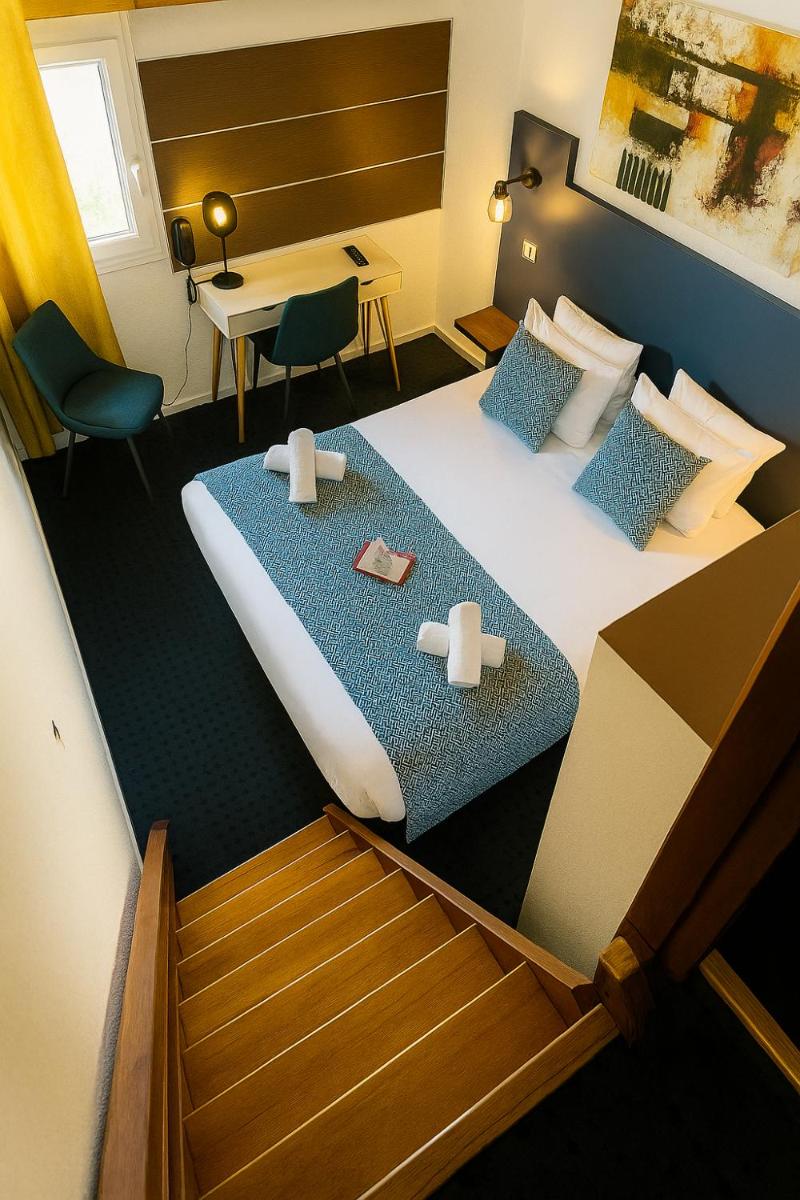 Un ou plusieurs lits dans un hébergement de l'établissement Hotel & Spa Gil de France Cap d'Agde