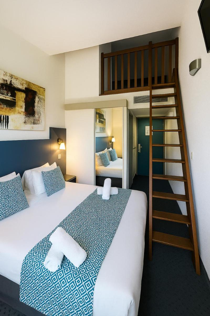 Un ou plusieurs lits dans un hébergement de l'établissement Hotel & Spa Gil de France Cap d'Agde