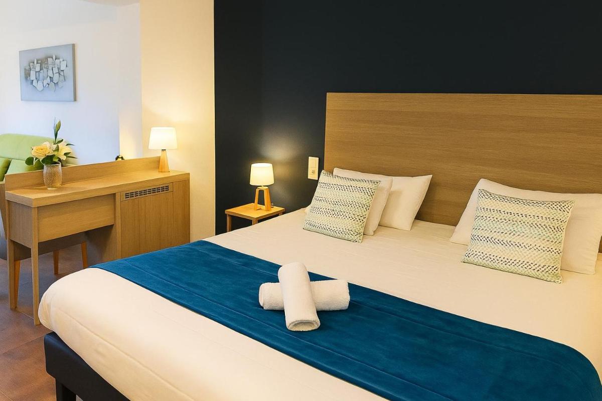 Un ou plusieurs lits dans un hébergement de l'établissement Hotel & Spa Gil de France Cap d'Agde